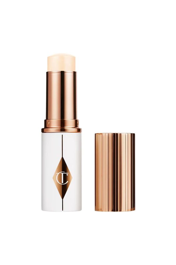 کرم فاندیشن اورجینال برند Charlotte tilbury مدل Unreal Skin Sheer Glow Tint کد 880881632